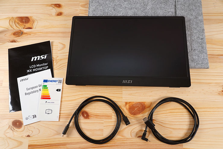 盒內所有物品，包括 MSI PRO MP161 E2U 本體、收納包、說明指引手冊、一條 USB-C to USB-C 線、一條 mini HDMI to HDMI 線。